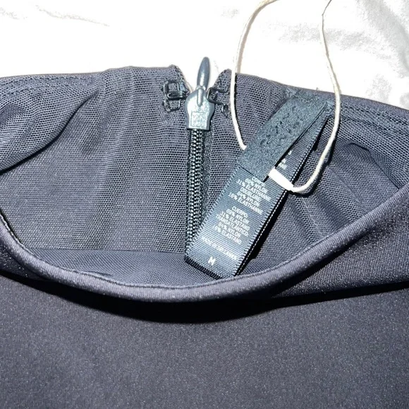 SKIMS ALL-IN-ONE LONG SLEEVE MID THIGH ONESIE - Picture 7 of 15